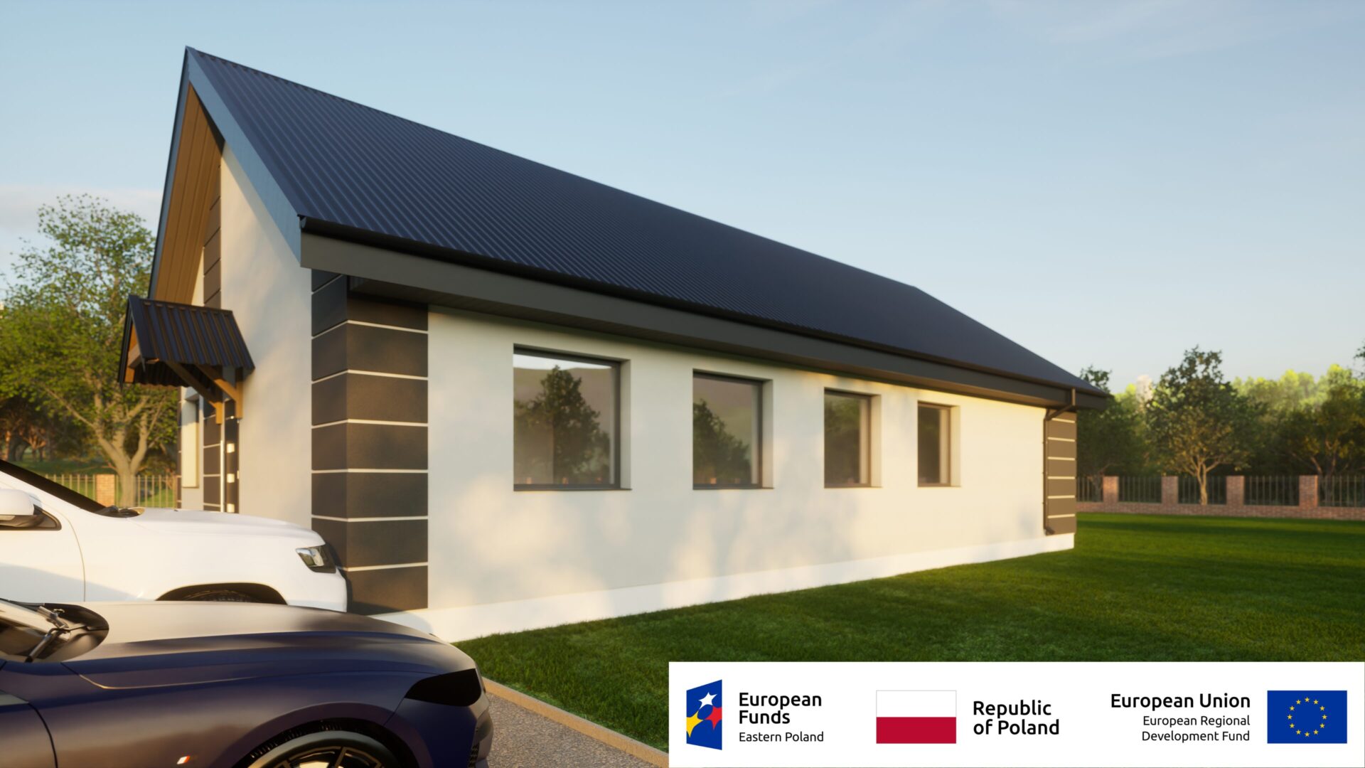 Nowoczesny budynek z dwuspadowym dachem, otoczony zielenią, wspierany przez fundusze unijne.