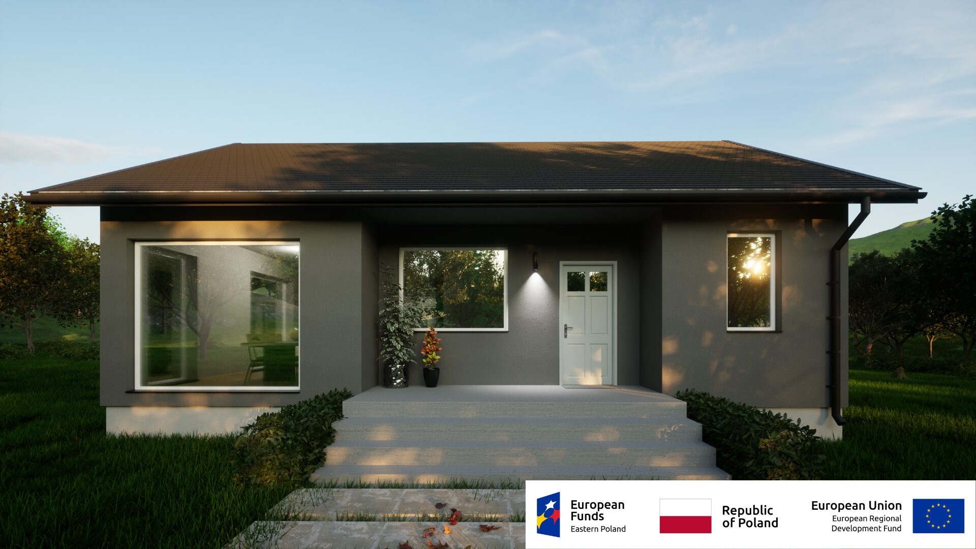 Nowoczesny dom parterowy z ogródkiem, szary tynk, duże okna, wieczór. Fundusze Europejskie Polska Wschodnia.